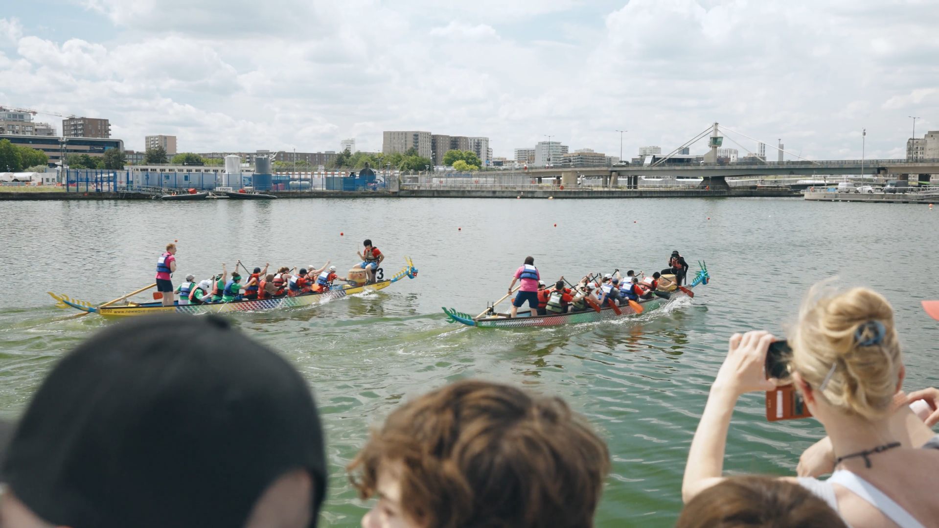 Spectators watching crews cross the finish line